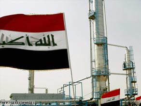 Iraqi flags flutter during the opening ceremony of a new oil refinery plant in the Shiite holy city of Najaf.