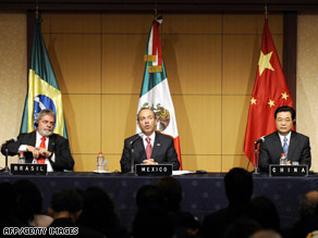 Leaders from Brazil, Mexico and China talk to reporters Tuesday in Hokkaido, Japan during the G-8 summit.