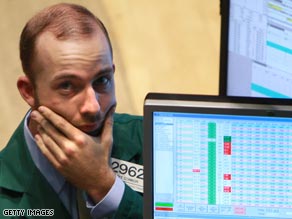 Floor traders at the Hong Kong Exchange react Tuesday to news of falling shares.