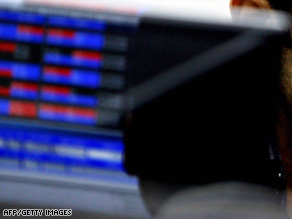 A stock broker looks trades at a brokerage firm in Mumbai on November 11.
