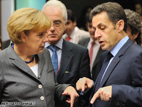 German Chancellor Angela Merkel talks with French President Nicolas Sarkozy at Friday's meeting.
