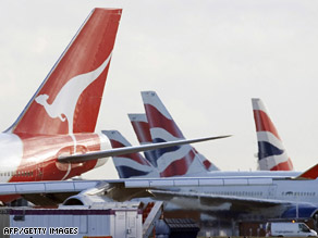 A Qantas aircraft is pictured beside British Airways aircraft at Heathrow airport, west of London, on December 4.