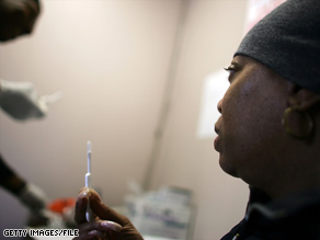 A woman uses the Oraquick rapid HIV testing device at a New York health clinic in 2006.