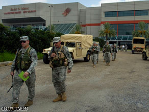 Louisiana National Guard members arrive at the New Orleans convention center during preparations for Gustav.