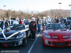 Saturn owners show off their Sky roadsters after a Christmas parade in Soddy-Daisy, Tennessee, on Sunday.