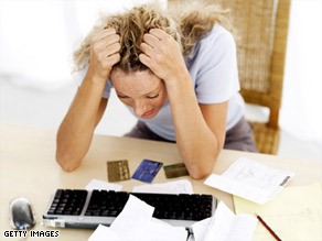 Overspending and not opening bills can be signs of financial anxiety.