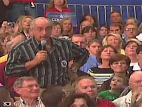 An angry supporter confronts Sen. John McCain at a rally in Wisconsin on Thursday.