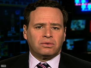 David Frum says Barack Obama would cement his power over Hillary Clinton by putting her in his Cabinet.