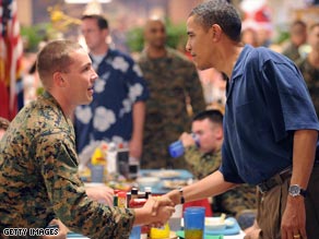 President-elect Obama shakes hands with troops having Christmas dinner at a military base in Hawaii.