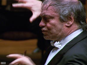 Valery Gergiev uses his eyes to convey the feeling of the score while performing with the London Symphony Orchestra.