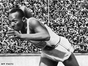 Owens defied Hitler by winning four gold medals in Berlin in 1936.