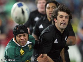 All Black Conrad Smith (right) gets tackled by Springbok Adrian Jacobs during the opening Tri-Nations Test.