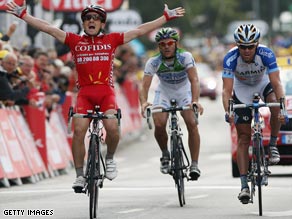 Samuel Dumoulin of France and Cofidis crosses the line to win stage three of the 2008 Tour de France.
