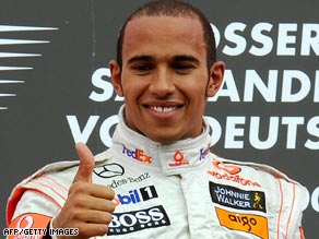 Lewis Hamilton gives his McLaren team the thumbs-up after a sensational drive to win the German Grand Prix.