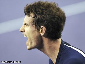 Murray enjoys the moment after sealing his straight sets win over Frenchman Simon in Shanghai.