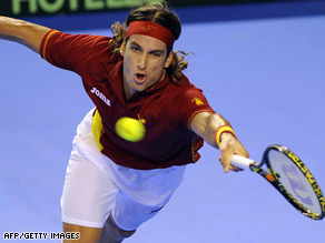Nalbandian broke Ferrer's serve seven times as he gave Argentina a perfect Davis Cup start.