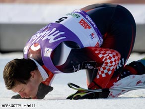 Croatian Ivica Kostelic kisses the snow after his first slalom victory for five years in Italy.