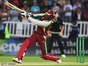 Gayle hits a six off Vettori during the eliminator over which yielded 25 runs.