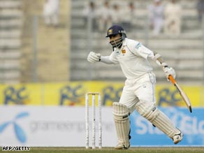 Sri Lanka captain Mahela Jayawardene celebrates his century in the opening Test against Bangladesh.