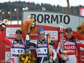 Innerhofer (center) is flanked on the podium by Kroll (left) and Walchhofer.