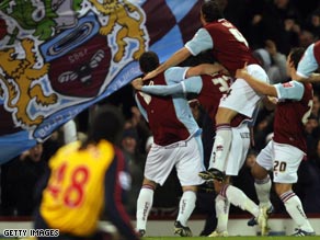 Burnley players celebrate as Kevin McDonald fires them to within one step of a Wembley Carling Cup final.