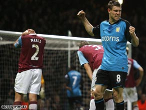 James Milner (right) celebrates after Lucas Neill's own goal gave Aston Villa the three points.