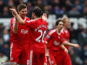 Gerrard (left) is congratulated by Javier Mascherano after scoring at St James' Park.