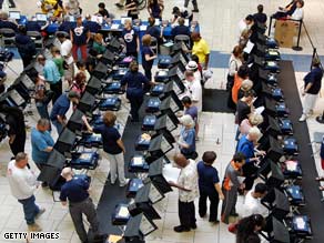 Early voters cast ballots on touch-screen machines Wednesday in Las Vegas, Nevada.