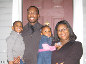 Daniel and Ebony Sampson with their children. "It's a personal miracle," she says of how their home was saved.