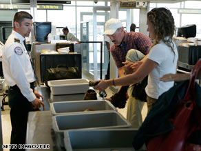 Passengers prepare for a security screening at Washington Dulles International Airport in Virginia.