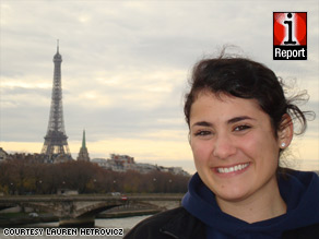 Lauren Hetrovicz, 21, stands across the river from the Eiffel Tower in Paris, France.