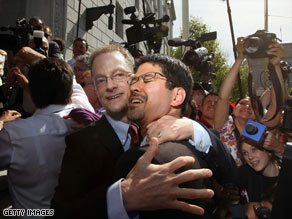 Gay couple John Lewis, left, and Stuart Gaffney celebrate outside the California Supreme Court on Thursday.