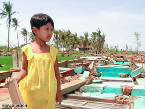 Nway walks the ruins of her village school, which was destoryed by Cyclone Nargis.