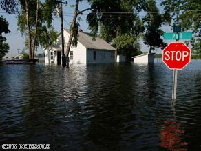 Flooding from the Mississippi River surrounds a home in Foley, Missouri, in late June.