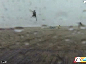 Wind lifted Kevin Kearney over a Fort Lauderdale beach before slamming him into a building Monday.