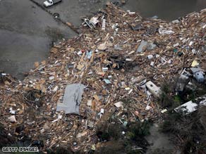 Some residents fear that remains of missing people will be found in piles of debris scattered across Gilchrist, Texas.