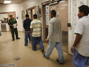 Illegal immigrants are processed in August at a U.S. Border Patrol station near Laredo, Texas.