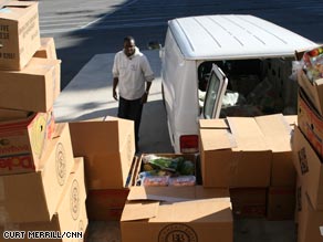 Shawn Wray picks up a food donation Tuesday to distribute to families in need in Atlanta, Georgia.