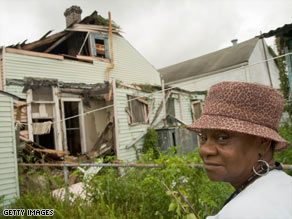 Sherrie Hoppal cleans out her Texas home that was flooded by Hurricane Ike in September.