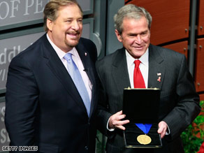 Rick Warren, left, presents President Bush with an award Monday in Washington.