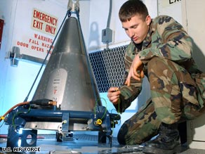 In an Air Force file photo, an airman inspects a missile part at a training site.