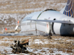 Injured passengers are taken to a hospital after Saturday's accident at Denver International Airport.