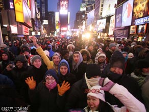 Onlookers get a close-up view of the New Year's Eve ball during a test of it Tuesday in New York City.
