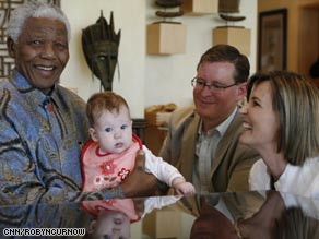 Baby Freya cries as Mandela tries to placate her.