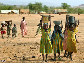 Refugee girls pose for a picture at a camp in Darfur.