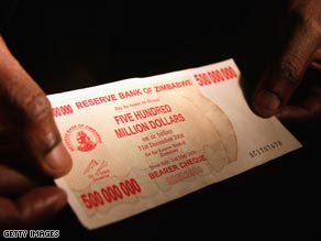 A shopper displays a $500 million Zimbabwean bank note.