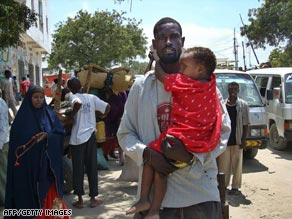 A Mogadishu resident flees after fighting among insurgents and  peacekeepers on September 24.