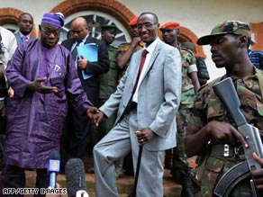 U.N. special envoy Olusegun Obasanjo, left, poses with Congolese rebel leader Laurent Nkunda after talks.