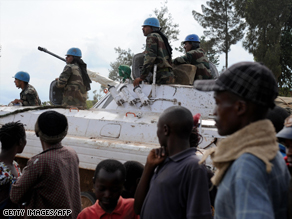 U.N. troops enter a peacekeeper base in Kanyabayonga on Tuesday.