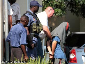 Johan Nel leaves the courthouse in January. He was sentenced Friday to four life terms in prison.